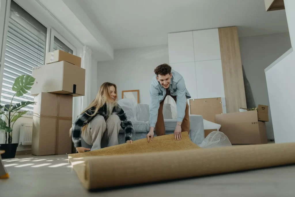 Happy couple packing the contents of their house ahead of moving