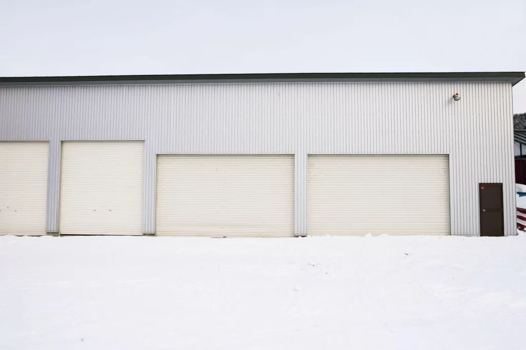 Storage units at Uncle Bob's with floor covered in snow during winter